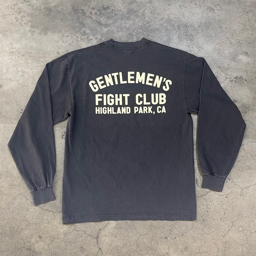 Back of long sleeve faded black shirt.  Cream colored graphic print reads "Gentlemen's Fight Club Highland Park, CA"